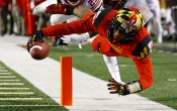 Maryland wide receiver D.J. Moore, right, scores a touchdown in front of Wisconsin cornerback Derrick Tindal in the first half of an NCAA college football game, Saturday, Nov. 7, 2015, in College Park, Md. (AP Photo/Patrick Semansky)